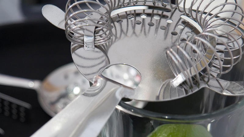 Hawthorne strainer will help you filter out any shards of ice. It also has self-adjusts to fit most bar tumblers.