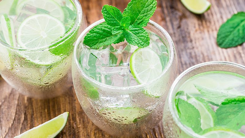 Glass of cocktail garnished with Mint Leaves