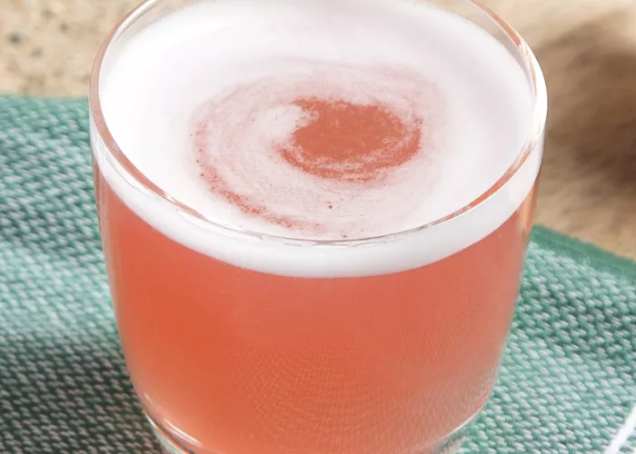 Glass of Sex On The Beach on green piece of cloth