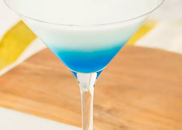 Glass of DeKuyper® Mintini garnished with mint leaves