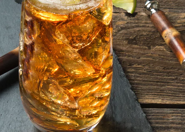 A glass of Cruzan® Safe Harbor garnished with  Lime Wedge 