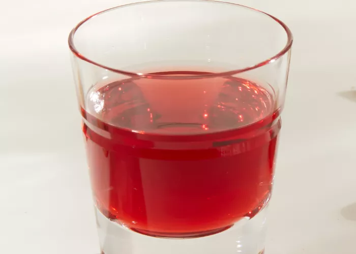 A glass of SQRRL® PB&J Shot