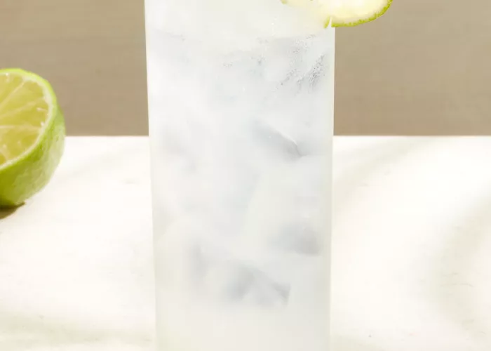 A glass of Sauza® Mexican Paloma garnished with Lime Wheel
