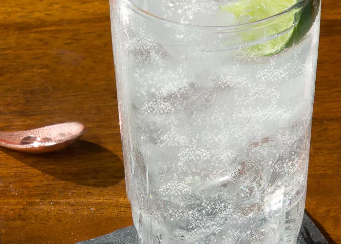 A glass of Sipsmith® Gin and Tonic garnished with Lime Wedge