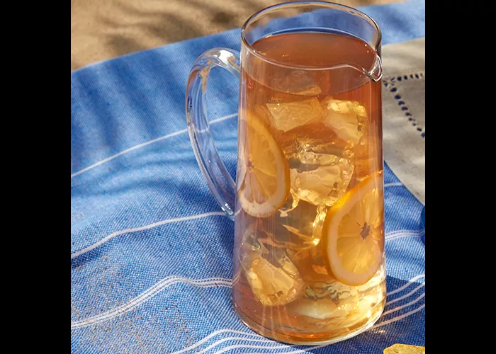 A glass of LemonWedge garnished with LemonWedge 