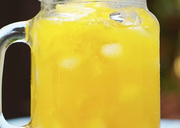 A glass of Banana Nana garnished with  banana slices