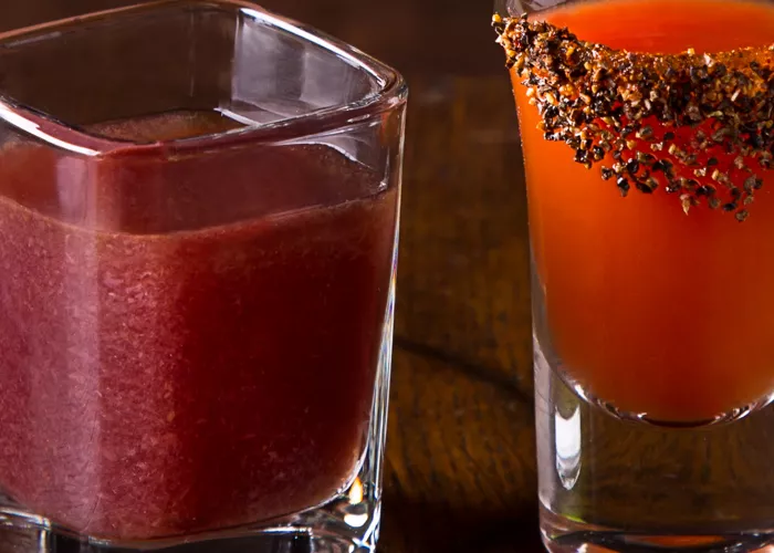 Glass of Stars Bloody Mary alongside glass of Stripes Bloody Mary