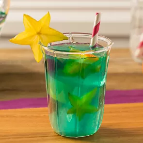 Glass of Blue Lagoon Sangria garnished with starfruit slice 