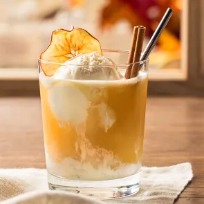 Glass of Apple Cider Float topped with icecream and cinnamon stick