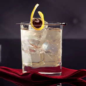 Glass of Vodka Beast Garnished with brandied cherries.
