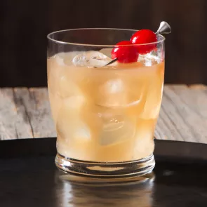 Glass of Tropical Spice garnished with cherries