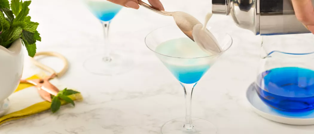 Peron pouring DeKuyper® Mintini into glass