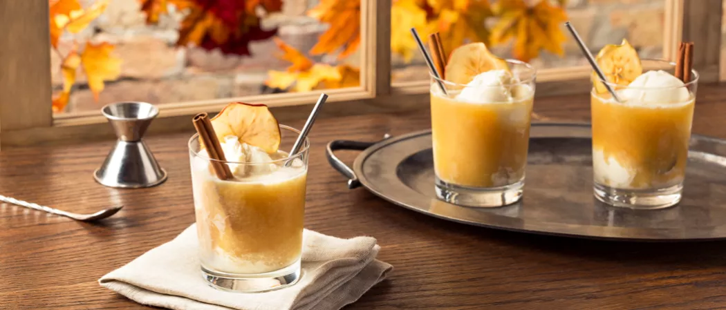 Three glasses of Apple Cider Float topped with icecream and cinnamon stick