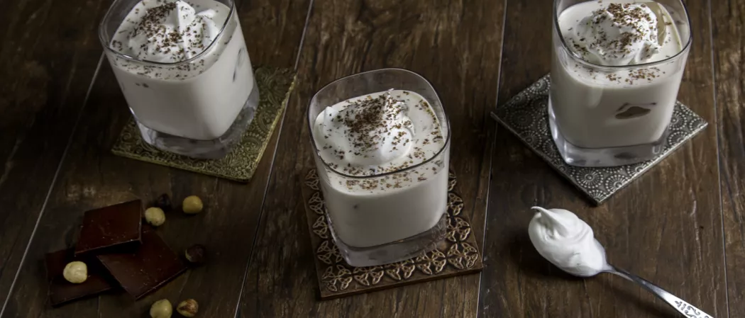Three glass filled with bourbon ball with one spoon