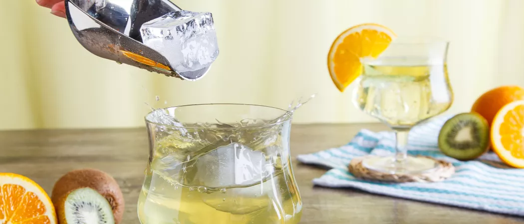 Adding ice into glass of Cruzan® Daiquiri