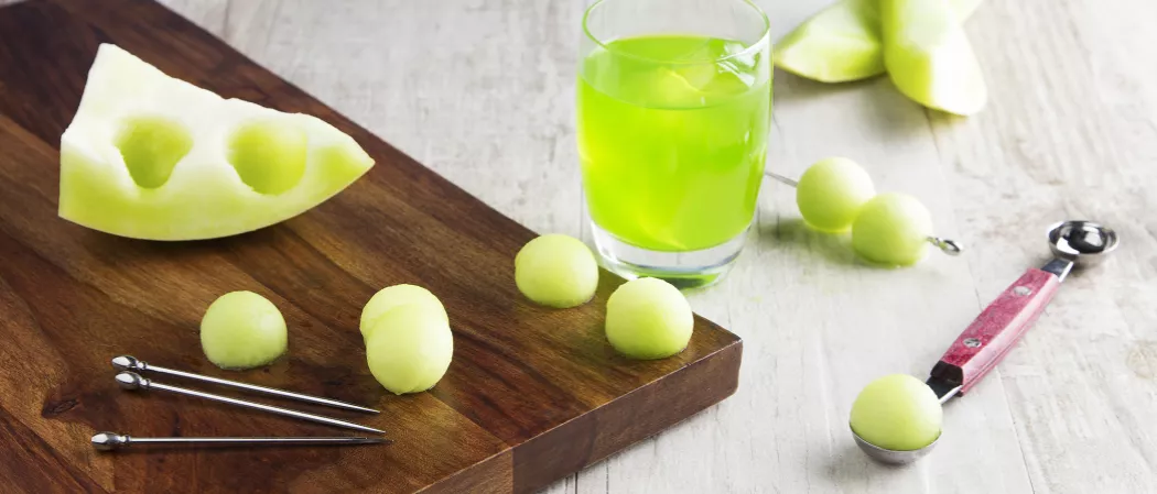 A glass filled with melon ball