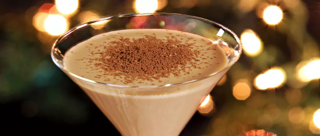 Glass of Chocolate Martini garnished with chocolate powder.