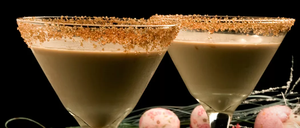  two glasses of Peanut Butter Cup Martini rimmed with brown sugar