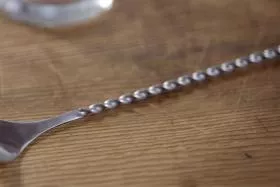  One stirrer spoon on wooden surface