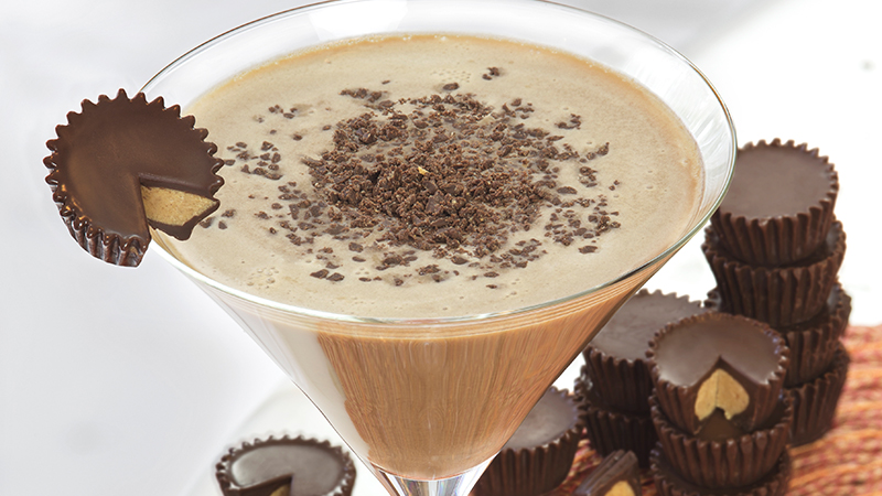 Glass of cocktail garnished with chocolate
